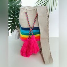 Description: Rainbow Retro Handwoven Crossbody Bag Brand New! I Designed And Commissioned This Bag From Wayuu Woman. The Wayuu Are An Indigenous Tribe In Colombia Known For Their Beautiful Handwoven Work, And This Bag Represents About A Week's Worth Of Work. Details: Handmade Item- Handwoven Color: Beige, Neon Pink, Yellow, Green, Light Blue, Dark Blue, & Orange Material: 100% Acrylic Width: 11.5" Height: 11" Total Length: 25" Style: Hippie/ Bohemian /Retro/ Classic Mochila / Pop Of Color Casual Pink Crossbody Bucket Bag, Pink Woven Crossbody Shoulder Bag, Pink Woven Bucket Bag For Beach, Pink Woven Bucket Bag For The Beach, Pink Crossbody Shoulder Bag For Vacation, Beach Pink Woven Bucket Bag, Pink Handwoven Bucket Bag For The Beach, Pink Crossbody Crochet Bag For Daily Use, Pink Crochet Crossbody Bag For Daily Use