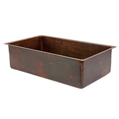 an old, rusty metal container is shown against a white background for use as a planter