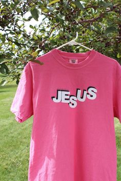 Hi! Welcome to KaleaCustoms! This shop spreads Gods love with positive christian messages and trending worship apparel. This shirt shares the message, "My Life Belongs To Jesus", a simple statement filled with truth. Using sustainable brands such as Cricut and Comfort Colors, we were able to make this oversized, preppy, worship t-shirt. Pink Cotton Inspirational T-shirt, Inspirational Pink Cotton T-shirt, Inspirational Pink Crew Neck Top, Inspirational Pink T-shirt With Text Print, Inspirational Pink Tops With Text Print, Pink Cotton T-shirt With Lettering, Worship Apparel, Aesthetic Worship, Gift Aesthetic