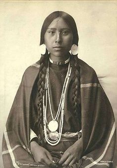 an old photo of a native american woman