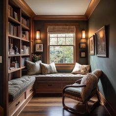 a window seat in the corner of a room with bookshelves on either side