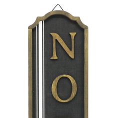 a black and gold sign with the word no on it