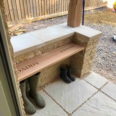 two pairs of boots are sitting on a bench