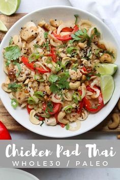 chicken pad thai noodles with cashews and cilantro in a white bowl