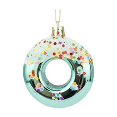 a glass ornament with confetti on it