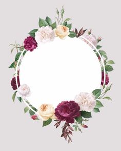 a round frame with flowers and leaves around it