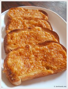 three pieces of toast on a white plate