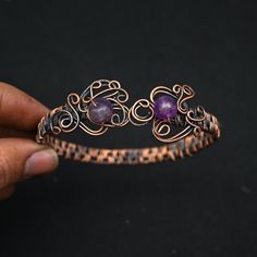 Handmade Amethyst Bangle As A Gift, Handmade Amethyst Bangle For Gift, Handmade Amethyst Bangle, Spiritual Purple Amethyst Cuff Bracelet, Spiritual Amethyst Cuff Bracelet In Purple, Adjustable Hand Wrapped Purple Bracelets, Round Metal Gemstone Bracelets, Purple Wire Wrapped Bracelet, Spiritual Purple Bangle Bracelet