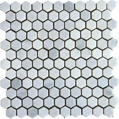 white hexagonal tile with grey dots