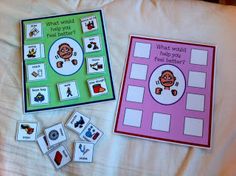 two game boards and matching cards on a bed