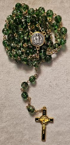 Handmade rosary beads color green mix beads with gold dust beads and Saint Benidict crucifix and center with gold accents Handmade Rosary, Gold Rosary, Saint Benedict, Gold Dust, Rosary Beads, Rosary, Gold Accents, Green And Gold, Bead Charms