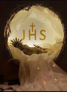 a woman laying on top of a white sheet under a lighted sign that reads jhs