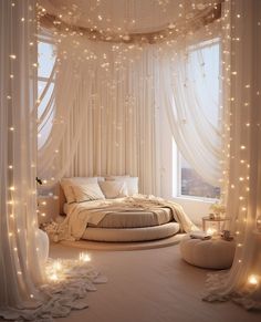 a white bedroom with lights on the ceiling and curtains over the bed in front of it