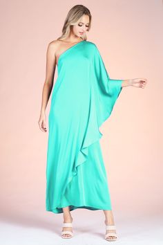 Gear up for your formal events with this angelic Soft Athena One Shoulder Maxi. This piece is made with our soft and beautiful poly silk, leaving you feeling luxurious and comfortable. The one shoulder is timeless and falls to the wrists, keeping you covered and ready for any weather climate that comes your way. One shoulder neckline Maxi length Draped sleeve Soft satin-like finish Self: 100% Poly | Lining: 100% Poly Made in USA SKU #: D-7756 Drape Sleeves, Weather And Climate, Saved Items, Formal Event, The One, One Shoulder, How Are You Feeling, Satin, Silk