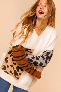 This sweater is has the softest fabric and the cutest animal print details, fits slightly oversized. 70% POLYESTER 30% ACRYLIC Cute V-neck Fall Sweater, Leopard Print Long Sleeve Sweater For Spring, Long Sleeve Leopard Print Sweater For Spring, Trendy Leopard Print Winter Sweater, Trendy Tiger Print Tops For Fall, Winter Leopard Print Long Sleeve Sweater, Leopard Print Long Sleeve Winter Sweater, Leopard Print Long Sleeve Sweater For Winter, Long Sleeve Leopard Print Winter Sweater