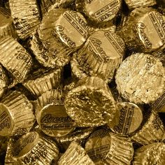 gold foiled hersheys are stacked on top of each other in this close up photo