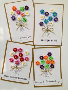 four greeting cards with colorful flowers on them