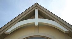 the corner of a building with a cross on it