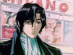 an anime character is standing in front of a store with his eyes closed and looking at the camera