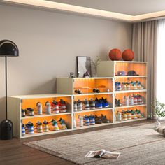 a living room filled with lots of different types of shoes on shelves next to a large window