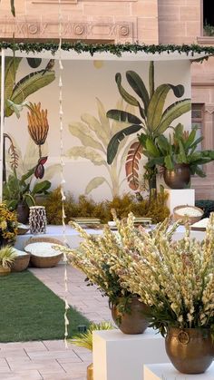 an outdoor area with potted plants and decorations