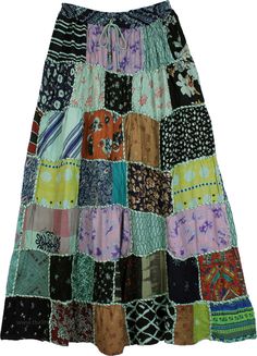 A cheerful ankle-length skirt with mixed patchwork, this rayon fabric skirt has a chic bohemian style.  It features square dori that gives it a unique artisanal look. #tlb #Patchwork #MaxiSkirt #Printed #bohemianfashion #longrayonskirt #patchworkskirt #squaredoriskirt Green Bohemian Patchwork Maxi Skirt, Bohemian Green Patchwork Maxi Skirt, Hippie Multicolor Patchwork Maxi Skirt, Hippie Patchwork Multicolor Maxi Skirt, Hippie Multicolor Maxi Skirt With Patchwork, Multicolor Patchwork Maxi Skirt For Festivals, Patchwork Maxi Skirt, Skirt Patchwork, Clothing Wardrobe