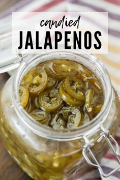 a jar filled with sliced jalapenos sitting on top of a table