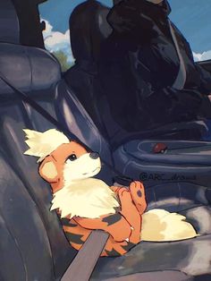 a dog sitting in the back seat of a car with its paw on it's chest