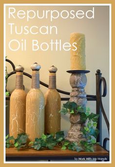 three bottles are sitting on top of a table with ivy growing around them and the words repurposed tuscan oil bottles