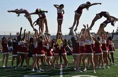 the cheerleaders are doing stunts on the field