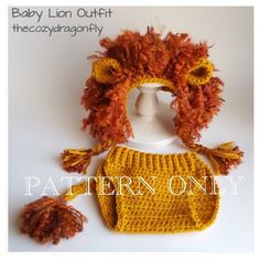 a knitted lion hat and diaper cover with pom poms