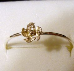 This listing is for the single little flower ring only. we designed the little flower and put it on a 1mm hammer faceted band. I will make a ring like this for you in your size ! I would like about 3 to 5 days to complete it. All metal is .925 sterling silver from reclaimed/recycled sources. It is eco friendly and guilt free. The stones we use are all ethically mined/made and cut, Fair Trade and guilt free as well. :) I am calling it the Sun Series because it is too hot to go outside and play al Adjustable Sterling Silver Promise Flower Ring, Dainty White Gold Sterling Silver Flower Ring, Dainty White Gold Flower Ring In Sterling Silver, Adjustable White Gold Sterling Silver Flower Ring, Adjustable White Gold Flower Ring For Anniversary, Adjustable White Gold Flower Ring For Promise, White Gold Flower Toe Ring For Anniversary, White Gold Toe Ring For Anniversary, Stackable Sterling Silver Flower Ring For Anniversary