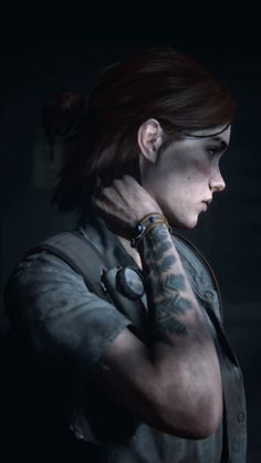 a woman with tattoos on her arm standing in front of a dark background and looking off to the side