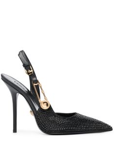 125mm safety-pin leather pumps from Versace featuring black, calf leather, rhinestone embellishment, signature Medusa Safety Pin detail, pointed toe, buckle-fastening ankle strap, branded leather insole, gold-tone hardware and 125mm high stiletto heel. Versace Safety Pin, Versace Pumps, Chic High Heels, Versace Shoes, Black Outfits, Safety Pins, Crystal Embellishment, Slingback Pump, Safety Pin