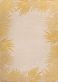 a yellow and white rug with palm leaves on it