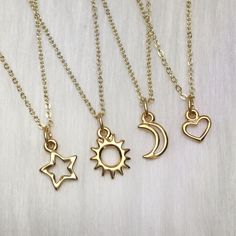 Sun Moon Star Heart friendship/ family necklaces D E T A I L S: Your choice of 10mm gold finished pewter Moon, Sun, Heart or Star pendant on 18" gold plated brass necklace, with tiny clasp closure.  Also available in silver (YES, you can mix gold and silver, leave me a note at checkout!) https://www.etsy.com/listing/500073607 ..: V I E W   S H O P:.. www.lotusfairy.etsy.com www.shopEarthshine.com ..: P O L I C I E S :.. Please see the drop down FAQs menu All items are FINAL SALE. ★ I M P O R T A Gold Heart Charm Necklaces For Friendship, Adjustable Gold Charm Necklace For Best Friend, Gold Heart Charm Necklace For Best Friend, Gold Pendant Charm Necklace For Friendship, Dainty Nickel-free Necklaces For Friendship, Adjustable Gold Charm Necklaces With Heart Charm, Gold Celestial Charm Necklace, Adjustable Gold Celestial Charm Necklace, Dainty Gold Necklace For Friendship