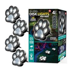 four light up paw prints are shown in front of a box