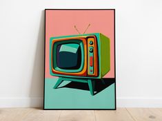 an old fashioned television sitting on top of a wooden floor in front of a pink wall