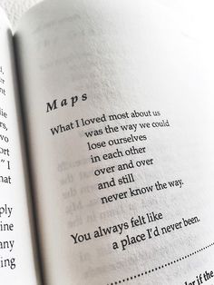 an open book with the words maps written in cursive writing on it's pages