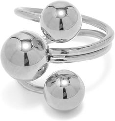 two silver rings with balls on each ring and one ball in the middle, all stacked together