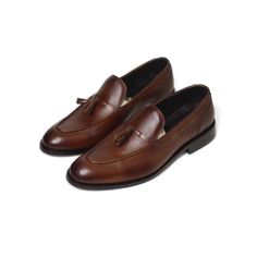 These handcrafted tassel loafers are made with pure calf leather, buffalo leather insole, and lining. Featuring a stainless steel buckle and pure leather sole, these exquisite loafers exude luxury and style. Elevate your wardrobe with this timeless masterpiece in footwear craftsmanship. All designs are made to order and each piece is uniquely created with a personality in mind; strong, significant, and one-of-a-kind. Finished product is delivered within 18-20 days after order is received. We are High Ankle Boots, Cow Calf, Tassel Loafers, Buffalo Leather, Leather Tassel, Derby Shoes, Party Shoes, Handmade Shoes, Custom Shoes