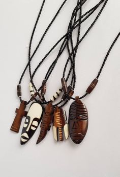 This listing is for ALL 5 African pendant necklaces like shown above. They are made using animal bones. You will get; *2 mask necklaces *Lizard *Cross *elephant Buy multiple items and pay shipping for ONE item ONLY. They ship through DHL Express. More neckleces here; https://www.etsy.com/shop/TribalTess?ref=seller-platform-mcnav&section_id=21306083 Back to my shop; https://www.etsy.com/shop/TribalTess?ref=seller-platform-mcnav Animal Bone Jewelry, African Necklaces, African Inspired Jewelry, Loc Jewelry, Mask Necklace, Bone Necklace, African Necklace, Bone Pendant, Animal Bones