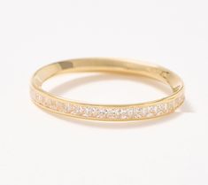 a yellow gold wedding band with princess cut diamonds