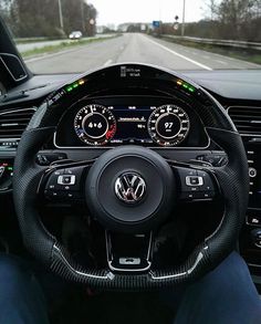 the steering wheel and dashboard of a volkswagen car