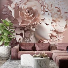 a living room filled with furniture and a large flower mural on the wall behind it