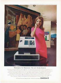 a woman in a pink dress standing next to a machine