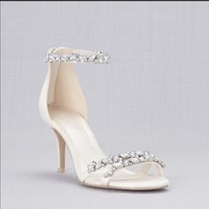 Brand New! Brand New With Box Style:Arden Color: Ivory Crystal Embellishments Ankle Strap Back Zipper Heel Height: 2.50 Inches Satin Upper Synthetic Sole Elegant Open Toe Heels With Silver Accents, White Embellished Wedding Shoes, White Embellished Wedding Shoes For Formal Occasion, Formal White Embellished Wedding Shoes, Wedding Heels With Rhinestones In Synthetic Material, Elegant Silver Embellished Wedding Shoes, Silver Ankle Strap Wedding Shoes With Crystals, Crystal-embellished Open Toe Wedding Shoes For Reception, Crystal-embellished Open Toe Heels For Wedding Reception