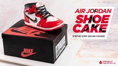 an air jordan shoe cake sits on top of a box with the words nike above it