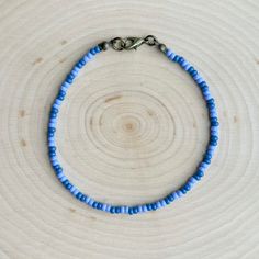 This is the Blueberry Beaded Anklet.  It is super cute, with lots of blueberry vibes!  This anklet is beautiful and elegant, yet also great for everyday casual wear. - It is fastened with antiqued bronze coated brass pieces, and is made with durable native glass seed beads. - My beads are always purchased here in Oklahoma from local native sellers. - It is 8.5" long with options for a 1" or 2" extender chain making it up to 10.5" long. *Note: Due to differences in device screens, the colors may Purple Tiny Beads Bracelets For Beach, Purple Beaded Bracelets For Beach With Tiny Beads, Purple Beaded Bracelets With Tiny Beads For Beach, Blue Beaded Chain Bracelets For Beach, Trendy Adjustable Anklets With Tiny Beads, Trendy Round Bead Anklets For Gift, Summer Beaded Bracelets With Heart And Round Beads, Adjustable Colorful Beads Anklets, Adjustable Anklet With Colorful Round Beads