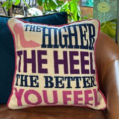 a pillow that says, the higher the heel the better you feel on a couch